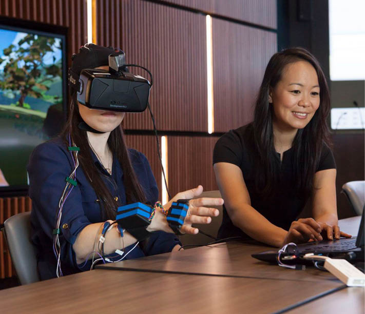 Sook-Lei Liew works with a stroke patient using VR  (Photo Nate Jensen)